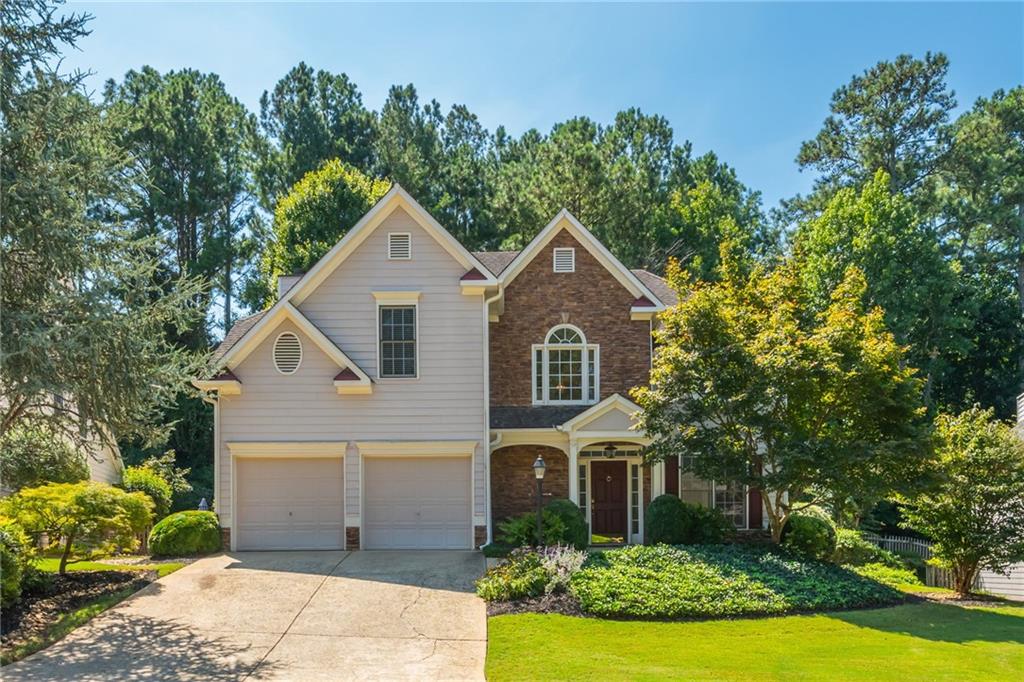 Welcome Home! Don't miss this original owner home in the fabulous Deer Run Subdivision! Fresh Interior Paint throughout along with all new Carpet and new LVP Flooring in Primary Bath. Enter into this spacious, light filled home with Hardwoods in 2 story Foyer and Kitchen, Beautiful Archways, Built Ins in Family Room and Secondary Bedroom, Large Closets and more. Enjoy many entertainment spaces with Kitchen open to Family Room and then Dining and Living Room combo as well as the walk out Patio off Kitchen. Once in the Backyard, enjoy the serene professionally landscaped space with privacy and arbors on either side of the home. The front welcomes you with so much curb appeal and manicured landscaping that is kept looking great with irrigation system that is on it's own separate water line. Kitchen has great sized Pantry, so much Counter Space, Stainless Fridge that remains with the home and a view to Family Room and Backyard. Upstairs there are 4 generous sized Bedrooms, including Primary with 2 Walk In Closets, a Bump Out Sitting Area, Tray Ceiling, Two Vanities, Separate Shower and Tub and private water closet. Also upstairs is a Guest Bath with separate sink and toilet/tub/shower area and large Laundry Room. Close to Interstate, Downtown Woodstock, Shopping, Schools, Restaurants and more! Amazing amenities in the Sought After Deer Run Subdivision including Pool, Tennis Courts, Pickle Ball Courts, Clubhouse, Basketball Court, Playground and more!