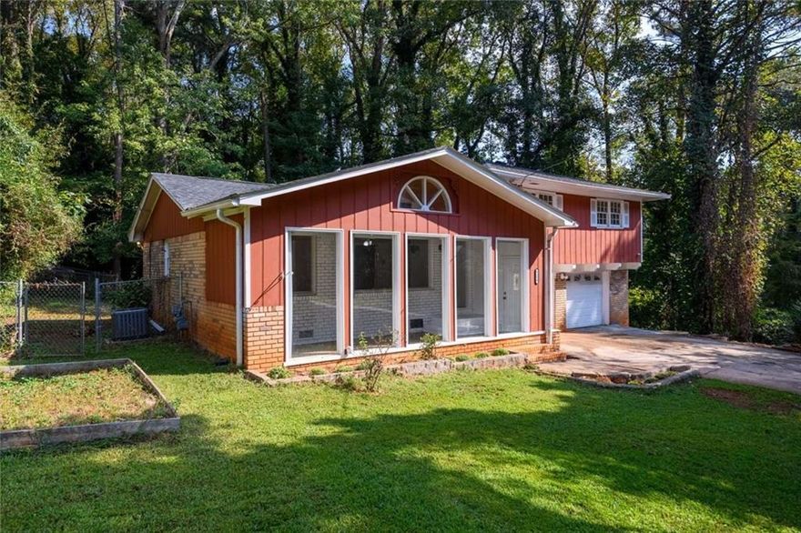 Enjoy this large, open layout contemporary home in a rustic environment. The 3 Bdrm with 2-1/2 upgraded bathrooms is on a large lot next to the Dekalb County rustic field for privacy. Lots of open areas in the house. Great Cul de sac to safely play and explore the area. Fenced off backyard area ideal for setting up a barbeque and sitting area in addition to the rear porch and waterfall Large fenced off dog area with dog house for your pets. The home features fans throughout, clean interior paint, new LVP downstairs and wall-to-wall carpet upstairs. Black kitchen appliances, new engineered countertop, washer/dryer hook-ups, security system, and 2 car garage. Upgraded bathrooms. Room adjacent to kitchen, living room, dining room, and kitchen nook with a very open floor plan provide ample space for gathering, relaxing and making this home comfortable for everyone. Easy access to route 78 and I-285 for an easy commute to downtown or shopping centers. Stone Mountain Park is nearby for the outdoor experience. Quaint downtown redeveloped attracting new attractions and visitors.