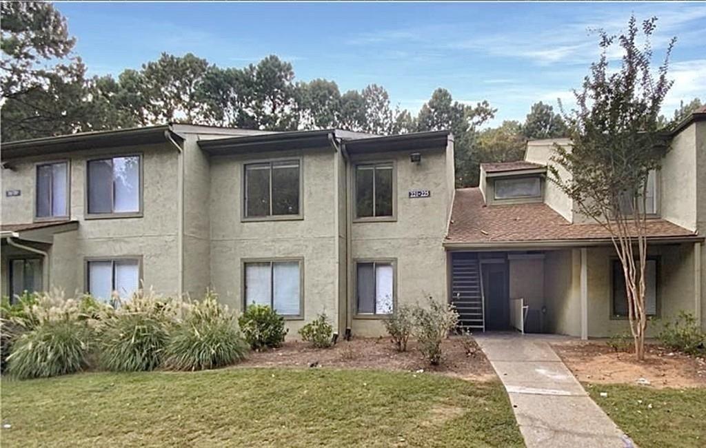 Location, Location, Location! Seller offering $2500 in concessions!! Don't miss this incredible opportunity to own a private, gated gem in the heart of Norcross, offering the carefree lifestyle you deserve! Enjoy resort-style amenities, including a large pool, clubhouse with a stylish lounge, fully equipped fitness center with a play area, outdoor tennis courts, playground, picnic/grill area, and pet-friendly spaces. This popular 2-bedroom, 2-bathroom floor plan has been freshly updated with new paint and a beautifully finished sunroom featuring vinyl plank flooring-perfect for year-round enjoyment with serene, wooded views. The open living space is filled with natural light and features a cozy wood-burning fireplace. The kitchen boasts stainless steel appliances, ample counter space, and beautifully stained cabinets that open to a spacious dining room. The primary suite offers his-and-her closets and an attached full bath with a tub/shower combo and vanity seating. The second bedroom is versatile and spacious, ideal for family, guests, or even a combined home office and guest space. Conveniently located near public transportation, major highways, shopping, dining, schools, parks, and recreation. HOA dues cover all amenities, exterior maintenance, water, sewer, termite protection, and daily trash pickup. No rental restrictions-an excellent investment opportunity! Schedule your showing today and make this hidden oasis your own!