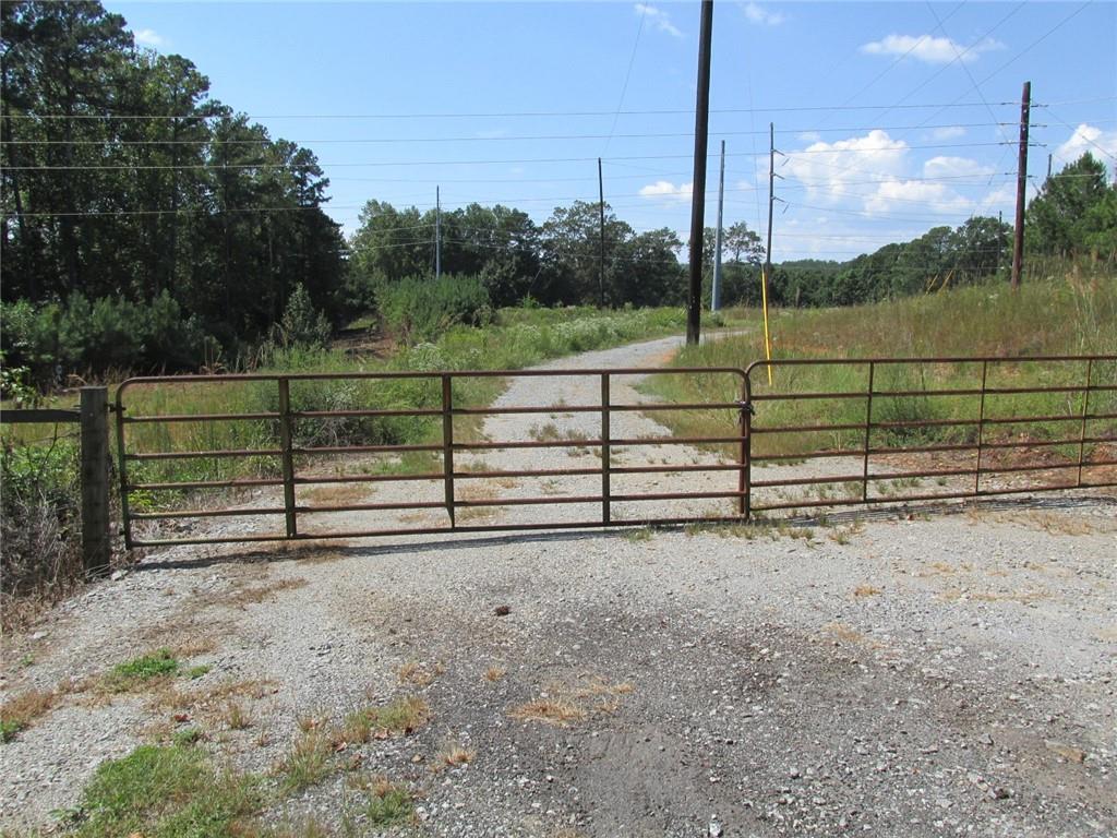 Your Next Commercial Hub Awaits: 4.21 Acres of Opportunity in Canton
Expand your business operations with this exceptional 4.21-acre parcel in Canton, strategically positioned for maximum efficiency. Located in a thriving industrial district with direct access to I-575 at Holly Springs Parkway, this lot is the logistical solution you've been searching for.
Forget the hassle of new construction and capitalize on the property's key strengths. With current building restrictions, this site is perfectly tailored for use as an expansive parking lot and equipment storage yard. It provides a secure, centralized location for managing your fleet of tractor-trailers, box trucks, and commercial vehicles, as well as for consolidating your heavy machinery and materials.
This property is more than just a lot—it’s a strategic investment that puts your business at the heart of key transportation routes, driving down operational costs and boosting productivity. Secure your footprint in one of North Georgia's most dynamic industrial corridors today.