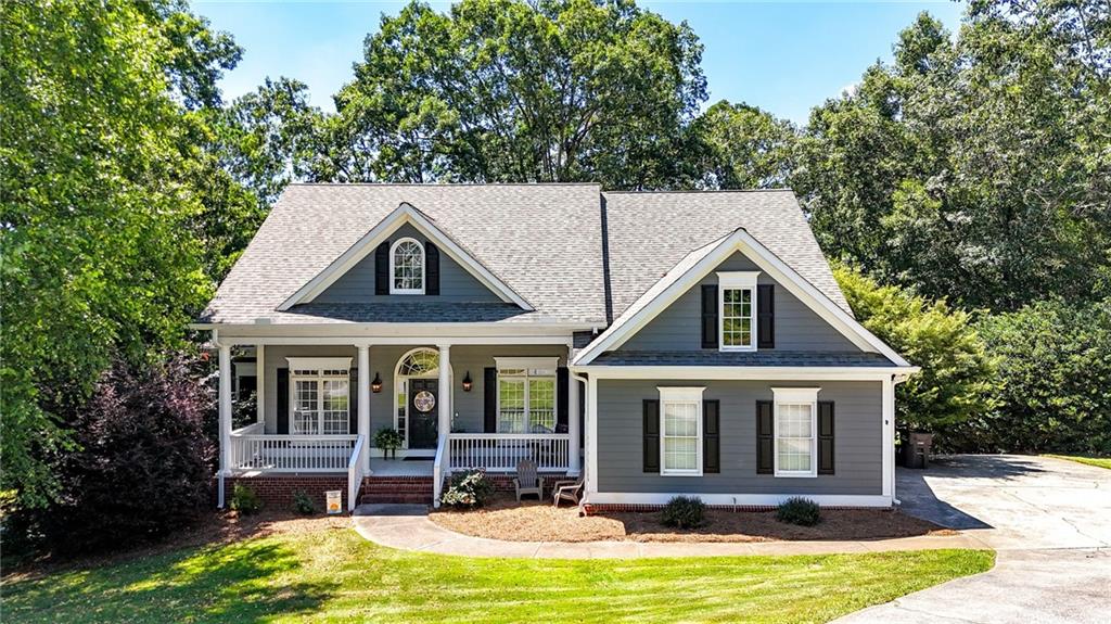 A craftsman style ranch that is 2 homes in one and ready for immediate occupancy! This home blends timeless charm with contemporary updates. The main level boasts a welcoming family room with built-in shelves, abundant storage, beautiful hardwoods, and a cozy fireplace. The separate dining room is ideal for entertaining, and the home office with French doors allows for a quiet workspace. The well-appointed kitchen features granite counters, a gas range, ample cabinets and an eat in breakfast room. The primary suite includes a newly renovated ensuite bath with a double vanity, custom soaking/jetted tub and walk-in shower. Two additional bedrooms share a large secondary bath and come with walk-in closets.
The finished basement enhances your living options with a full “second home”. Its own exterior entrance, an additional one-car garage, full kitchen, living room/ dining room, second primary suite including a second ensuite bath and large walk-in closet, a storm shelter/storage space. The lower level is rounded out with an additional office/bonus/game room, second bedroom and full bath, its own laundry room and private outdoor screened patio. This home is perfect for in-laws, adult children/teen suite, or as a potential rental opportunity! Minutes to downtown Cartersville, this home is in Cartersville City school district and in the well-established Parkside at Mission Estates swim/tennis community.