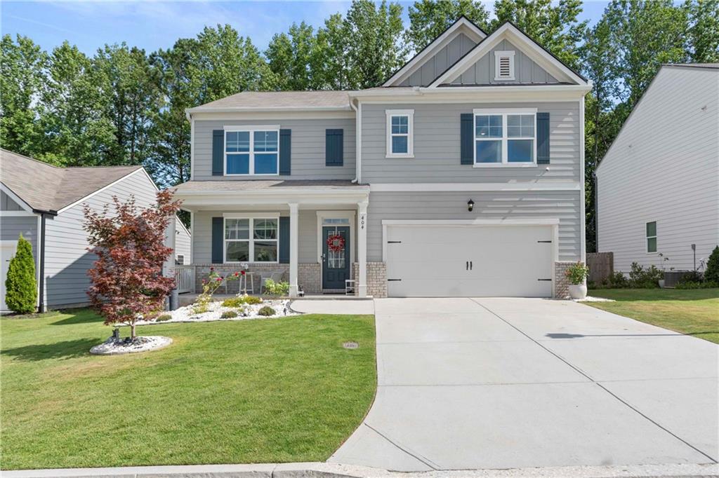 Better than new! This 5-bedroom, 3-bathroom home in Dawsonville, GA offers the perfect combination of style, comfort, and functionality. Built in 2022 and
meticulously enhanced with nearly $60,000 in custom improvements, this two-story property is a standout in a desirable swim/tennis community with easy
access to GA-400, local shopping, dining, and schools.
Inside, you’ll find an open-concept layout on the main level that features a spacious living room with a gas fireplace, a dining area filled with natural light,
and a beautifully appointed kitchen with stone countertops, a walk-in pantry, and an oversized island. A full bedroom and bathroom on the main floor offer an
ideal setup for guests or a private in-law suite. The 2-car garage provides ample space for parking and storage.
Upstairs, the primary suite offers a luxurious retreat with a double vanity, soaking tub, separate shower, and walk-in closet. Three additional bedrooms, a full
bathroom, and a versatile loft area provide flexibility for a home office, playroom, gym, or media room. The upstairs laundry room includes built-in storage
and is conveniently located near the bedrooms.
What truly sets this home apart is the exceptional outdoor living space. The backyard has been completely transformed with a professionally installed
retaining wall to create a walk-out yard, making it both beautiful and functional. Enjoy lush zoysia grass in both the front and back yards—known for its
durability, density, and low maintenance—kept healthy year-round by a full irrigation system. Outdoor upgrades include an extended concrete patio, custom
pergola, and a fully equipped Mont Alpi outdoor kitchen with a gas grill, sink, refrigerator, wine cooler, and more. Stone pavers lead to a cozy fire pit area,
perfect for entertaining or relaxing. There are also raised garden beds and a storage shed that conveys with the property. The front yard has been
professionally landscaped with standout features such as a Japanese maple tree, gravel paths, and vibrant flower beds—giving this home exceptional curb
appeal.
Located in a vibrant community with a pool, clubhouse, tennis courts, and playground, this home offers convenience, luxury, and comfort all in one. If you're
looking for a move-in-ready home that’s been thoughtfully upgraded inside and out, don’t miss your opportunity to schedule a private showing today!