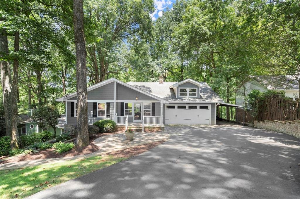 Welcome to your dream lake house on deep water at 2220 Forest Drive, perfectly positioned in a fantastic location in the heart of Cumming, GA! This newly renovated gem offers an exceptional living experience. Imagine sipping morning coffee or evening cocktails on your multi-level deck with killer lake views.
Inside, the open-concept living area is perfect for entertaining, featuring a cozy stacked stone fireplace. The kitchen, outfitted with stainless steel appliances and elegant white cabinets, offers stunning lake views that might just steal the spotlight from your culinary creations.
The owner's suite is conveniently located on the main level, ensuring a retreat-like experience. Downstairs, you'll discover a huge finished basement with 2 bedrooms—ideal for guests or family—and ample space to hang out, play pool, or watch the big game with friends. It’s the ultimate spot for relaxation and entertainment.
Step outside to your private oasis: a hot tub, natural stone firepit, and a gentle path leading to your personal covered 32x32 single slip dock on deep water. Whether you're into boating, jet skiing, or sunbathing on the tanning platform, this lakefront home has it all.
Conveniently close to downtown Cumming, GA 400, shopping, and dining, this location offers everything you could want within reach. Dive into lakefront living today!