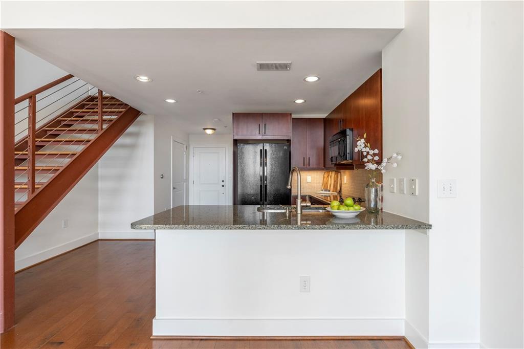Welcome to your luxury home in the Shoe Factory Lofts in the center of the premier Edgewood Retail District of Atlanta. This location combines a live, work, shop, dine and play environment so you can access your everyday conveniences just by walking out your front door. The Shoe Factory Lofts are a mid-rise condominium building built in 2006 to offer an industrial, modern and open concept vibe. Convenient amenities include a pet walk, private covered parking, guest parking, outdoor patio/grill area, and gazebo.
As you enter your new second floor apartment home, step into a spacious living area adorned with sleek hardwood floors and soaring ceilings. You will be embraced by a luxurious atmosphere of industrial grandeur and urban sophistication complimented by enormous loft style windows that allow natural light to flood the space. The open floor plan seamlessly integrates the living, dining, and kitchen areas, perfect for entertaining guests or relaxing in comfort. This split level loft adds character and charm, with exposed brick walls and industrial-style accents. Ascend the stylish staircase to discover the serene loft bedroom retreat, complete with hardwood floors, a roomy walk-in closet, and a private full bath with a tub/shower combination. Experience culinary bliss in a sleek and modern kitchen, the centerpiece of your new urban sanctuary. Designed with both style and functionality in mind, this kitchen will inspire you to prepare meals with ease and efficiency. Granite countertops add luxury and durability. The modern appliances, undermount sink with contemporary fixtures and plenty of surrounding counterspace make cooking, dining and cleanup a pleasure. Enjoy conveniences such as a laundry closet equipped with your own washer and dryer. Experience the future of home climate control with Nest Learning Thermostats installed throughout the apartment in two zones for upstairs and downstairs.
Conveniently located within walking distance of upscale dining, shopping, entertainment, and cultural attractions, this loft condominium offers the ultimate urban lifestyle experience. With easy access to public transportation and major thoroughfares, you're just moments away from everything the city has to offer. Your new home is within 2 miles of Little Five Points, Fernbank Museum, Candler Park, Atlanta Beltline and two MARTA stations.
APPLY NOW on RentSpree! https://apply.link/3x8D2Qx