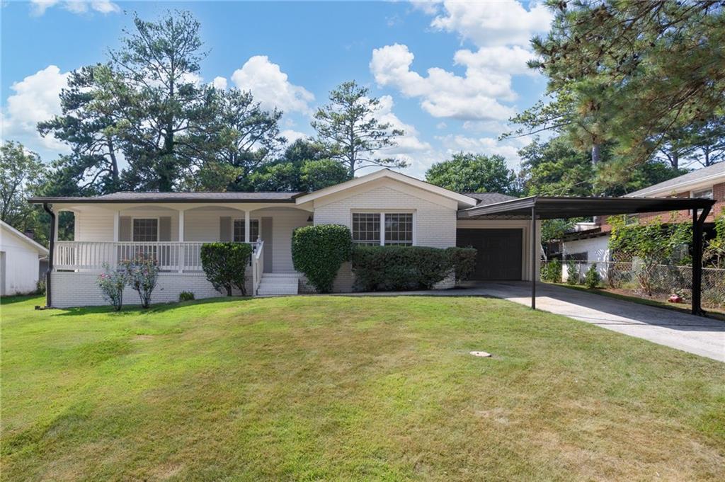 Don't miss your chance to get this beautifully renovated, Cobb County home for an amazing price! Conveniently located right in the middle of Cobb, you will be the envy of all your friends. The newly painted exterior is virtually maintenance free with a brick and vinyl sided exterior. The covered front porch is perfect for sitting and drinking your morning coffee or enjoying the evenings. As you enter the front door, you are set to impress your guests with the real solid oak hardwoods throughout. Large energy efficient windows allow all the light to fill the rooms. The brand new eat-in kitchen boasts stainless appliances, modern finishes, new upgraded cabinets, and quartz countertops. Make your way through the home to the best feature, the owner's suite! With a double vanity, modern lighting and plumbing fixtures, and a huge walk-in shower, you will not be disappointed with this space. You even have a large walk-in closet! There are two beautiful secondary bedrooms that share another wonderfully updated bathroom with tiled tub surround and updated vanity and fixtures. Step out back and find a new deck in the large, flat, fenced yard. There is even a new roof and new garage door and opener. This one really is move-in ready and waiting for you.