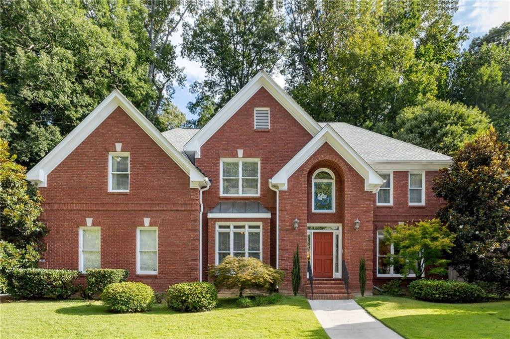 Welcome to this stately all-brick traditional home nestled on a quiet cul-de-sac street in the highly sought-after Oak Grove neighborhood. Step into the beautiful two-story foyer featuring hardwood floors on main level, a bright and open floor plan and wonderful space throughout! The main level offers multiple living spaces including a formal dining room, living room, bedroom with full bath, large fireside family room open to expansive kitchen with loads of cabinet and counter space, center island with gas cooktop, and a large eat-in kitchen. Off the kitchen and great room is a wonderful private backyard with a large deck and loads of outdoor space ideal for grilling out and entertaining family and friends! Upstairs includes upgraded hardwood floors in the primary bedroom with a large ensuite bath and wonderful walk-in closet. Three additional bedrooms plus bonus room up including two with a shared bath, a third bedroom with ensuite bath, and a huge bonus room that would make an excellent media room, rec room, teen suite, or additional bedroom. The home has been meticulously maintained featuring a brand new roof, newer HVAC units, refinished hardwoods, and an ideal layout allowing for the buyer to make the space their own! Excellent neighborhood and fantastic Oak Grove location minutes to shopping, schools, restaurants, and so much more!