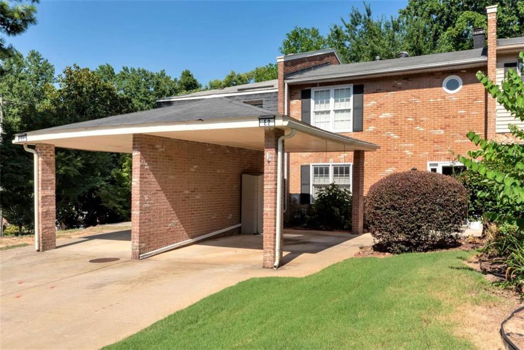 Welcome to this beautifully maintained 2-bedroom, 1.5-bath condo in the desirable lakeside community of Cinnamon Cove. This spacious unit offers exceptional value and comfort, featuring a cozy family room with charming built-in bookcases and a fireplace, plus a private deck and enclosed sunroom with peaceful wooded views. Upstairs, you'll find two generously sized bedrooms with ample closet space, a stylishly updated full bath with shower/tub, and a convenient half bath on the main level. Just steps from your door, enjoy community amenities including a pool, tennis courts, clubhouse, and walking trail to the lake. Located near Van Pugh Park with boat ramps, swimming, and picnic areas. Also close to downtown Flowery Branch's festivals and Farmers Market, as well as shopping, dining, Publix, Target, Home Depot, and lakeside favorites Pig Tales and Fish Tales. Just minutes to Mall of Georgia and about an hour to Atlanta Hartsfield-Jackson Airport. Enjoy low-maintenance, lakeside living in a serene and convenient location!