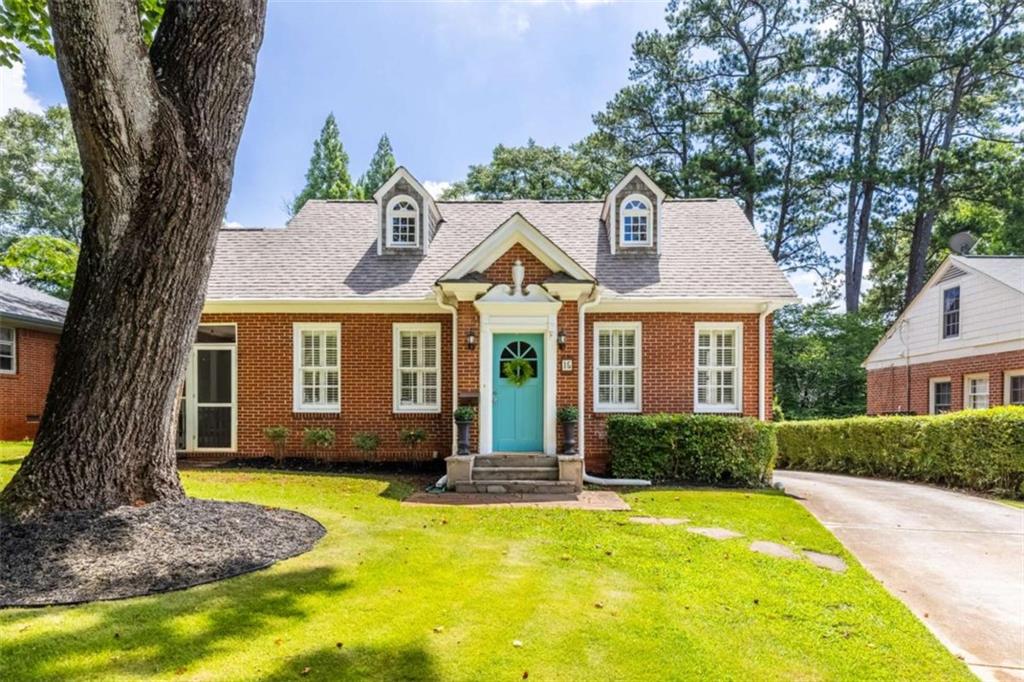 1920s brick traditional located in the heart of historic Avondale Estates. This spacious 4 bedroom 3 bath is the perfect blend of historic craftsmanship and modern touches-set on one of Avondale's best streets, this tranquil stretch of Clarendon boasts immaculate landscaping, gracious homes, and a welcoming community of neighbors. This home is like a warm hug-at every turn, you'll find sweet architectural details: cedar shake dormers, a charming juliet balcony, rich oak flooring, and built-ins with original glass panes and hardware. Step inside the cheerful blue front door and you'll be greeted by a beautiful living room with a fireplace, graceful archways, privacy shutters, and french doors to the first screened-in porch (the first of *3* magical outdoor spaces). Off the living room, a large dining room awaits your dinner parties and holiday gatherings. It's time to brush up on your cooking, because you're now officially the hosting house for your friends and family. A barn door separates the dining room from the kitchen, conveniently providing privacy when needed-those dishes can wait until tomorrow. A well-appointed kitchen is thoughtfully laid out for both daily use and entertaining. Solid wood cabinets offer plenty of storage, and cooking is a breeze with your gas range and ample counterspace. A reverse-osmosis water filter and prep sink offer added convenience, and barstools at the counter ensure you have a place to perch for those busy moments when you're eating on-the-go. The kitchen opens to the heart of the home, an expansive family room and eating area that spans the entire back of the house. Lined with windows and two sets of french doors, it's the perfect spot for cozying up on the couch for movie night, catching a post-Thanksgiving meal snooze in front of the game, or opening holiday gifts over hot chocolate. The family room opens to two additional outdoor spaces: a stone patio with pergola sets the stage for dining al fresco under twinkling fairy lights, and a quintessentially southern screened porch offers a dreamy retreat after a long day. Two bedrooms and a bathroom off the hall offer flexibility for guests, family members, or a home office. Upstairs, two oversized ensuites are nestled into the spacious eaves of the house, with each bedroom offering plenty of bonus space. An airy primary suite with sitting area overlooks the verdant backyard-soak in the peaceful views of this quiet haven. Possibilities are endless for the roomy front bedroom: bunk beds and playroom? This room is calling for a round of hide-and-seek! Between the 2 ensuites is a cozy landing that makes the perfect reading nook tucked at the top of the stairs. Downstairs, a basement with stairs to the kitchen offers additional space for your workshop, studio, or stashing your latest Costco haul-room for hobbies and adulting alike. A deep backyard (this lot goes back 198 feet!) is surrounded by lovely mature landscaping. There's more than enough room for cookouts, playing fetch, your backyard garden, and more. Avondale Estates is an idyllic community with unparalleled amenities. You're steps away from vibrant shops, restaurants, parks/walking trails, a community swim/tennis club, and tranquil lake. Conveniently located close to MARTA with easy access to interstates and Downtown Decatur.