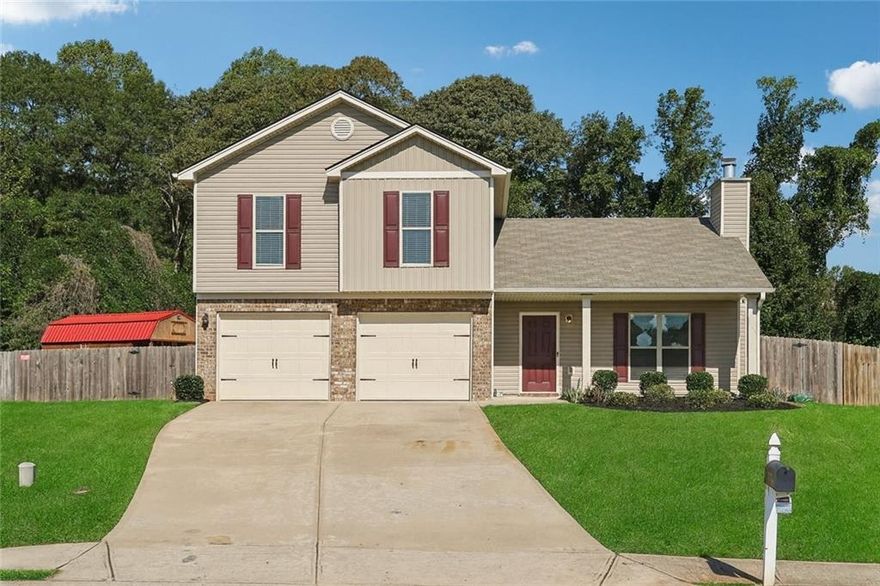 Welcome to this beautifully remodeled 4-bedroom, 3-bath home in the highly sought-after Waterford Glen neighborhood of Lula. Built in 2020, this light-filled residence greets you with soaring vaulted ceilings and an airy, open-concept living area that feels instantly inviting. The designer kitchen shines with brand-new stainless steel appliances, Calacatta quartz countertops, zellige tile backsplash, and custom floor-to-ceiling cabinetry—including additional pantry storage you won’t find in neighboring homes. The bathrooms feature tasteful updates, including new brushed-nickel fixtures that add a fresh, modern touch. Step outside to a fully fenced backyard—perfect for pets or play—and enjoy the convenience of a large tool shed that conveys with the property. Combining modern finishes, thoughtful upgrades, and a prime location, this home is truly move-in ready.