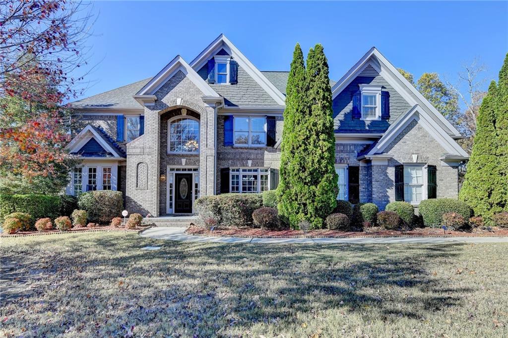 Price Reduced. One of the largest floorplans in Wild Timber S/D. Beautiful 3-side brick home with 5 bedrooms and 4 full bathrooms. Finished basement with 1 bedroom , 1 full bathroom and many more rooms. Large game room in 2nd level. Open floorplan view from the kitchen to the spacious family room. A very spacious master bedroom and master bathroom. Chattahoochee River access, playground, park, sand volleyball court, a lake and miles of walking trail throughout the community, This community has an active social committee with activities year round, a prize county swim team and tennis team for all ages. Children attend the highly coveted North Gwinnett School : Riverside Elementary, North Gwinnett Middle School and North Gwinnett High School.