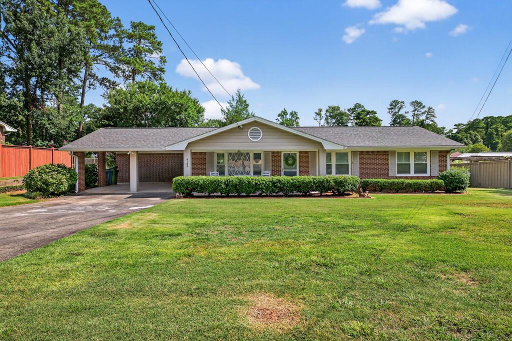 CHARMING RANCH HOME IN TUCKER-Welcome to this beautifully maintained 3 bedroom, 2 bath ranch nestled in the heart of Tucker. Featuring Hardwood floors throughout, this home offers a warm and inviting feel from the moment you step inside. Enjoy the spacious sunroom that overlooks a stunning, private backyard, perfect for relaxing or entertaining. With comfortable living spaces, the kitchen includes quartz countertops, tile backsplash, and glass front cabinets to display your treasures. The Sunroom is 315 square feet, the crawlspace is encapsulated with sump pump system, Recent exterior & interior painting, Roof & gutters 2018, windows replaced 2017, and recently serviced HVAC. There is a storage building that can be used for a workshop or a gardening shed. The rocking chairs on the front porch await you. Conveniently located with a walk to downtown Tucker or quick access to Hwy 78, 285.