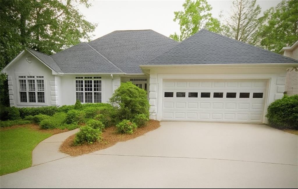 Lakefront Luxury Living! This immaculate open-concept ranch offers 4 spacious bedrooms, 2.5 bathrooms, and a fully finished basement, perfectly positioned for lakefront enjoyment. The main level features rich hardwood floors, a double-sided fireplace, and seamless layout ideal for entertaining. A gourmet kitchen awaits with premium countertops, large island cooktop, wall oven, wine chiller, and stainless-steel appliances. A spacious walk-in pantry provides exceptional storage and is a haven for organization. Meanwhile, the primary suite offers a tray ceiling and spa-style bath, complete with a separate tub and walk-in open shower. Downstairs, the finished basement includes a game room, second living space, workshop, and workout room for ultimate flexibility. Step outdoors to a massive deck overlooking the lake and a covered boat dock—ideal for lakeside leisure and entertaining. Located in a sought-after resort-style community offering 3 lakes, golf course, country club, tennis and pickleball courts, 2 pools, beach access, walking trails, recreation center, and 24/7 security. Convenient access to I-20 and Highway 166. Lake life awaits! Don’t miss this opportunity to own a beautiful retreat in an amenity-rich neighborhood. Schedule your private showing today!