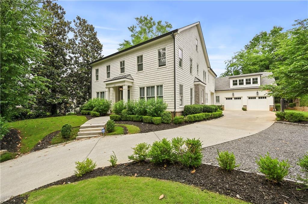 Welcome to the Home You've Been Waiting For! Built in 2019, this beautifully crafted cedar shake traditional offers EXCEPTIONAL design and LUXURY finishes throughout a spacious. Located on a private lot with a saltwater pool, this home is just minutes from top public and private schools, premier shopping, dining, and GA 400 access. The main level features a marble kitchen, formal living and dining rooms, family room with wood-burning fireplace, guest suite, pool bath, and mudroom off a two-car garage. Upstairs, the vaulted-ceiling primary suite includes a morning bar, dual walk-in closets, and a spa-like marble bath. A thoughtfully designed layout featuring a full bathroom conveniently located near the pool entrance. The master bedroom features built-in bookshelves and a cozy reading nook, creating a warm and inviting retreat. The master bathroom includes a double vanity, his-and-hers closets, a washer and dryer, and a luxurious, spa-like shower - everything you need without ever leaving your room. Upstairs, you'll find three additional bedrooms, each with its own full bathroom, along with a spacious laundry room for added convenience Bonus third level + private guest suite with kitchenette and separate staircase-perfect for home office or studio. This STUNNING home is perfect for entertaining and truly has everything you need!