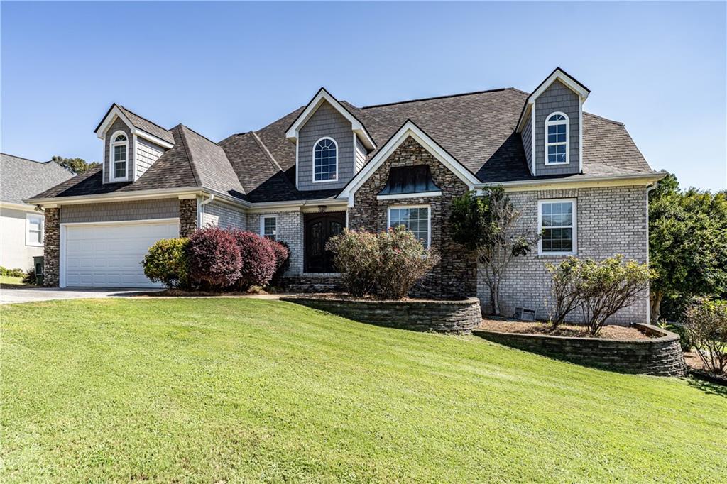 Spacious 6-bedroom, 3.5-bath home in Twickenham! This home features a stunning 2-story foyer and an updated kitchen overlooking the vaulted living area with a stone fireplace. Enjoy a separate dining area, plus a bedroom and full bath conveniently located off the kitchen/dining area. The oversized primary suite offers a tile bathroom with a walk-in shower and soaking tub. Upstairs are 3 additional bedrooms and another tile bath, while the finished basement adds a den and extra bedroom. Outdoors you can enjoy nice landscaping, large decks, an inground pool, an outdoor kitchen, and plenty of storage.