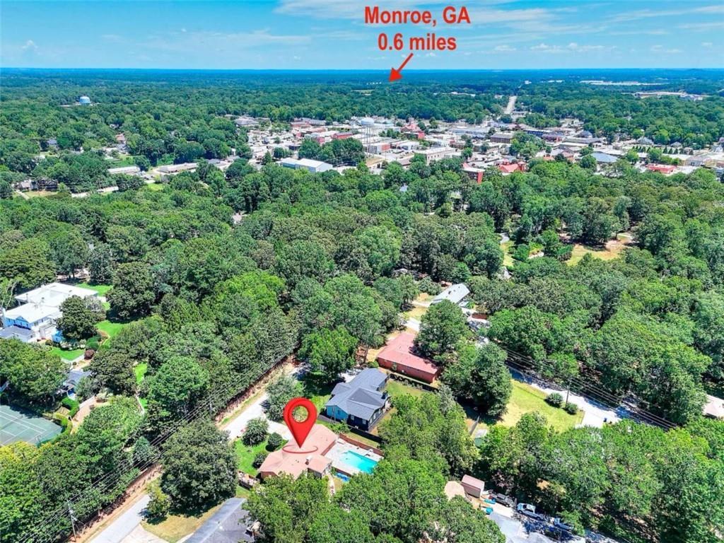 Coming Soon! Move to Monroe. This home is conveniently located to Downtown Monroe where you will find local shopping and restaurants along with community events that range from car shows to concerts. This classic 4 sided brick ranch home has it's own private oasis in the backyard with an inground pool. You will also find a detached garage for storage or a man cave. The inside has updated flooring along with a fresh coat of paint. The home will be available for showings July 31, 2025. Ask about our $15k first time home buyer grant with preferred lender for those who qualify.