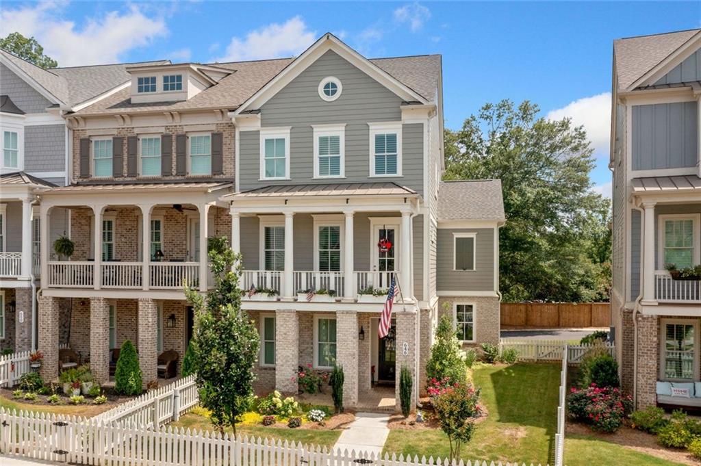 Enhance your lifestyle in this beautiful three-story end-unit townhouse featuring an ELEVATOR by John Wieland at South on Main! A perfect blend of modern design, luxury finishes, and unbeatable amenities awaits. Step inside this luxurious plan designed for contemporary living. The expansive three-car garage opens into a mudroom with bench seating, cubbies, and hooks for effortless organization. A keeping room with extra windows bathes the space in natural light. At the same time, the gourmet kitchen boasts 10-foot ceilings, tall cabinetry, quartz countertops, stainless steel appliances (including a microwave drawer) and a walk-in pantry. The kitchen flows seamlessly into the great room, featuring a gas log fireplace and built-in bookcases. Retreat to the primary suite with its private relaxation nook and an ensuite bath complete with a soaking tub, frameless glass shower, and tile to the ceiling. Upstairs, retreat to the primary suite with its private relaxation nook and an ensuite bath complete with a soaking tub, frameless glass shower, and tile to the ceiling. You will also find a secondary bath, and a laundry room with an extra-deep sink. Outdoor living shines with two front porches and a screened rear deck with Trex decking perfect for grilling. Upgrades include outdoor landscape lighting, landscaping, and plantation shutters. Located less than half a mile from downtown Woodstock, South on Main offers premium amenities, including a 6,000 sq. ft. clubhouse, fitness center, pool, dog parks, community garden, and more. Direct access to the Noonday Creek Trail makes this a dream home for active lifestyles!