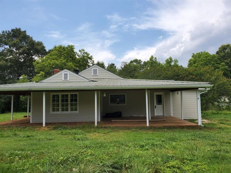 18+ Acres of Land! 3 Bedroom 2 baths Farmhouse with Renovated Interior, Hardwood Floors, Separate Dining/Office Room, and Bonus Room. Wrap Around Front Porch, Quonset/Storage Out building, endless Pasture, relaxing Creek, inclusive Serene Lot, abundance of Nature...all on 18+ Acres of beautiful Land! Don't miss this true Gem!