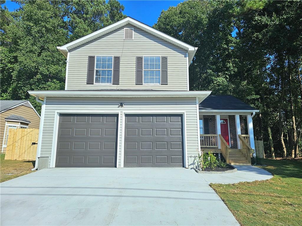 Totally renovated better than new home in this popular area of Wellborn Chase in Lithonia near Stone Mountain! New custom kitchen with granite counter-tops and stainless steel appliances. Spacious open living room & dining area. Separate family room with fireplace. All newly renovated bathrooms. Large master-suite with walk-in closet & large master bathroom with extra long vanity. All new systems, new roof & driveway. Double pane insulated glass windows. Beautiful new flooring throughout home. New large concrete patio overlooking backyard with new wooden privacy fence & landscaped sodded lawn. The asking price is well under what you'd pay for new construction in this part of town. This is a Great Deal for this top quality renovation!