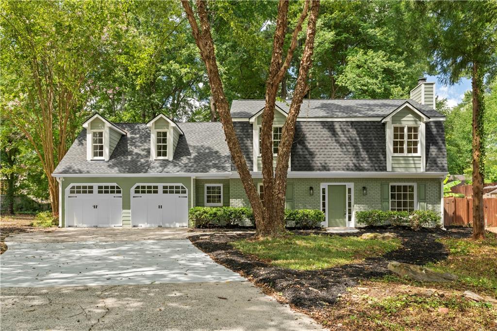 Welcome to this beautifully updated 4-bedroom, 2.5-bath home in the sought-after Saddle Ridge Lake community, a swim/tennis neighborhood offering fantastic amenities. This move-in ready property features a brand-new roof and water heater for peace of mind. Inside, the bright and inviting layout boasts fresh paint, elegant trim work, and spacious living areas. The updated kitchen offers stainless steel appliances, a subway tile backsplash, and plenty of cabinet space, opening to a sunny breakfast area. The family room centers around a cozy fireplace, creating the perfect spot for gatherings. Upstairs, a large bonus room provides endless possibilities—ideal for a media room, playroom, or home office. The owner’s suite includes a luxurious bath with double vanities and contemporary finishes. Step outside to an expansive patio overlooking a private, wooded backyard, perfect for entertaining or relaxing. Complete with a two-car garage and a prime location, this home blends comfort, style, and convenience.