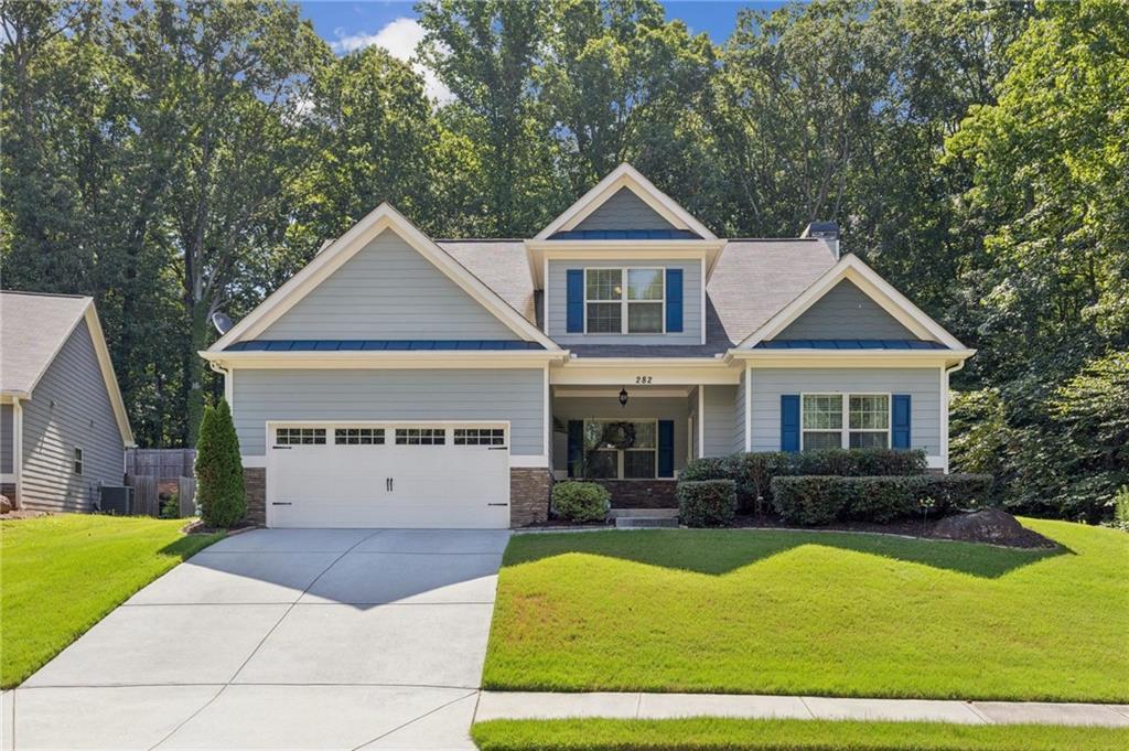 Welcome to 282 White Trillium Dr, Hoschton GA 30548--where comfort and convenience meet in this inviting single-family home. Boasting 3 spacious bedrooms and 2.5 pristine bathrooms, this property features an open layout designed for modern living. Enjoy the light-filled living areas, perfect for relaxing or entertaining, and a stylish kitchen that seamlessly flows into the dining space. Step into your patio retreat, ideal for outdoor dining, morning coffee, or unwinding after a long day. The primary suite is a true getaway, complete with his and hers closets and an en-suite bath for ultimate privacy. Perfectly situated just minutes from West Jackson Elementary School--rated highly for academic excellence--and the popular Mulberry Park, this home places you close to outdoor recreation, top-rated schools, and charming local dining options such as Hoschton Cafe, all within 2 miles. Don't miss your chance to own this exceptional home in a desirable neighborhood; schedule your private tour today and experience the best of Hoschton living!
