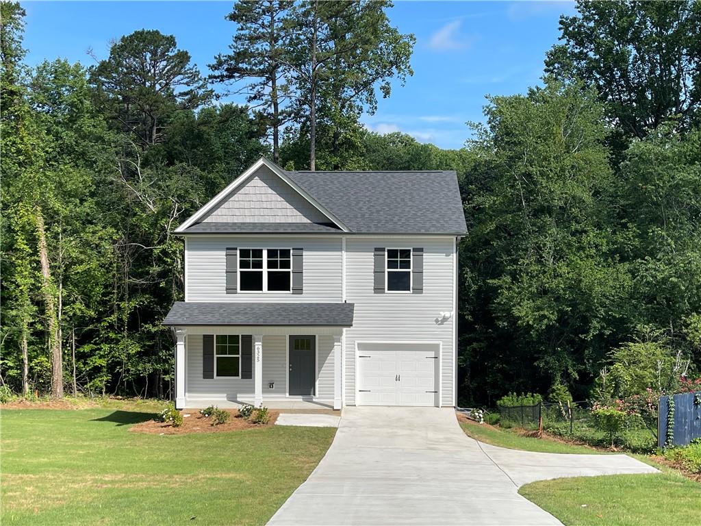 Location eligible for 100% USDA loan. Forsyth County. No HOA providing freedom and flexibility. Beautiful new construction on an unfinished basement already stubbed for a future bathroom, offering endless possibilities for customization. House located away from the road with long flat driveway. Plenty of parking, Desirable open floor plan including gourmet kitchen w/ white shaker cabinets, quartz counter tops, complete S/S appliance package, double vanity in main bathroom with walking closet and his closet, Luxury vinyl plank throughout for allergy free, and dust free living. Covered rocking chair front porch, huge front yard and a spacious entertainer’s deck, ideal for hosting gatherings or simply relaxing. Welcome home ! The Interior pictures are of a similar floor plan with same finishes for sale next door.