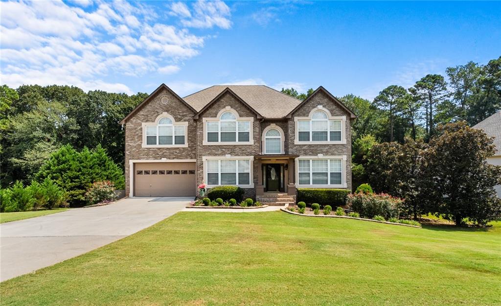 Spacious Family Home with Finished Basement in Stockbridge, GA Welcome to this beautifully designed family home in Stockbridge, offering three levels of living space and a layout perfect for everyday comfort and entertaining. Main Level: Bright 2-story foyer that creates an inviting entrance Separate living and dining rooms - ideal for family gatherings and holidays Large 2-story family room with cozy fireplace The kitchen featuring a gas cooktop, oven, prep sink, and tiled backsplash Primary suite on the main level with private full bath Convenient half bath and laundry room with washer/dryer Upstairs: Also has a Spacious primary bedroom with sitting area and full bath Two additional bedrooms, each with access to full baths Finished Terrace level; Entertainment ready with a wet bar and movie room Study and office area, perfect for work or homework space Bedroom with mini-kitchen, great for guests or teens Full bath plus a wine and beverage room for storage and entertaining needs This home offers plenty of room to spread out, whether it's enjoying family movie nights in the basement, hosting friends, or relaxing in one of the spacious bedrooms. With thoughtful features and flexible living areas, this Stockbridge home is ready to welcome its next family.
