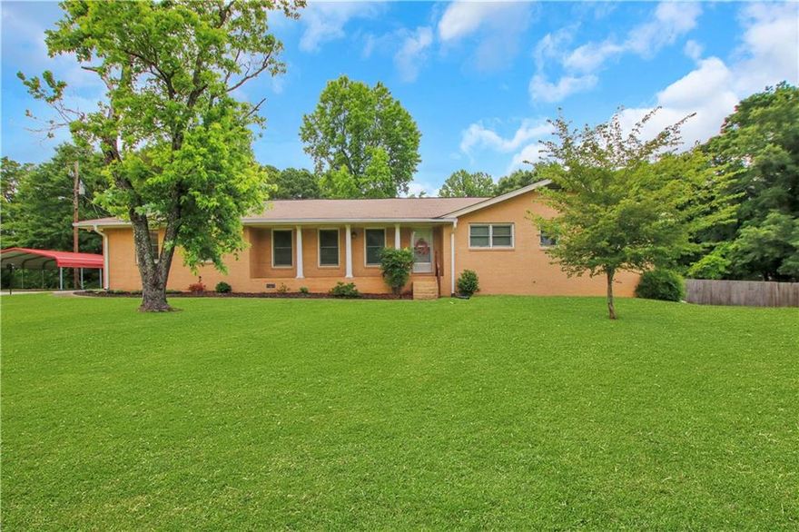 No HOA, nearly 2 acres, and an oversized 3-car detached garage workshop-this one checks all the boxes for space, freedom, and functionality. Whether you need room for trucks, trailers, or toys, you've got it here.    Inside, you'll find a renovated owner's ensuite, granite countertops, and custom cabinetry in the kitchen. A bonus flex room off the kitchen makes the perfect home office or rec space, and the dry basement with workbench and shelving is ready for your next project.    Tucked away just minutes from downtown Grayson and Tribble Mill Park, this four-sided brick ranch offers the peaceful lifestyle you've been looking for-with room to grow, play, or build.