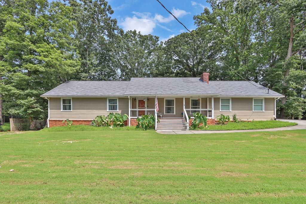 Totally updated RANCH with full finished Basement on beautiful 1/2 acre. 4 bedrooms/3 full baths. Every inch of this home was beautifully finished including the smooth ceilings with new light fixtures. Wow-beautifully remodeled kitchen with upgrades cabinets, SS GE Profile appliances, soft-close hinges and pull out shelving. Fabulous island. Large eating area. 2 dens or family rooms. Fireplace. Hardwoods thru-out living areas. Newer carpet in bedrooms. Newer roof! Tankless H20 heater. updated baths. Professionally finished basement with media room, bedroom, full bath, play room, office, and workshop. Finished backyard! Brookwood School District. No mandatory HOA. Perfect place to call home!