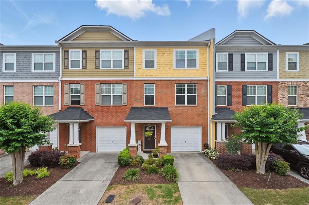 Welcome to 771 Tulip Poplar Way, a beautifully maintained townhome in a quiet, well-kept community in Lawrenceville! This charming home features spacious 9' ceilings that create an open, airy feel throughout. You'll love how the main level flows seamlessly from the living room to the dining area and kitchen, perfect for everyday living and entertaining. The HOA takes care of all exterior maintenance and landscaping, so you can enjoy low-maintenance living. The neighborhood is peaceful, safe, and full of respectful neighbors. Conveniently located just minutes from Hwy 316, I-85, and vibrant downtown Lawrenceville, you'll have quick access to great restaurants, shops, and more. Whether you're a first-time buyer or looking for a great place to call home, this one checks all the boxes!