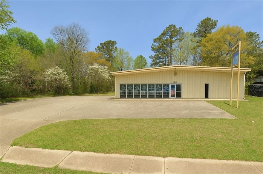 Rare availability, Free standing steel building located in a high traffic area near Austell Rd and Windy Hill Rd.  A church occupies the building now what was originally Fun Wheels Power Equipment.  The building features a glass front, double glass entry doors, loading dock, commercial roll up door, two additional walk through door entrance/exits.  220 and three phase power available.   Concrete parking lot.  Showing appointment is required and listing agent must be present for showings.  Please do not go to the property without an agent and an appointment.