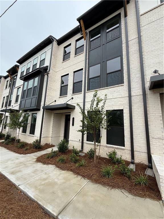 Brand New Construction townhome in the heart of downtown Lawrenceville! This brand-new home just became available for move-in for the first time. A spacious open floor plan with 9-foot ceilings welcomes you to the main living area. All stainless-steel new appliances, a massive 4-person kitchen island, spacious walk-in pantry, beautiful granite countertops and bright white kitchen cabinets make up the kitchen. Main level offers a dining area as well as a living room all with views from the kitchen. High end LVP flooring throughout with carpeted bedrooms. Three bedrooms and 2 bath upstairs with an additional bedroom with ensuite bathroom on the first level. Bedrooms offer large walk-in closets, plenty of natural light from windows and recessed lighting. Bathrooms are tiled with large showers, bathtubs and double vanities. Two car garage along with a 2-car driveway provide ample parking. Outside a full length, covered, back deck with ceiling fan and privacy wall.
ALL Appliances included - Washer/Dryer, Refrigerator, Microwave, Oven, Gas Range, and Dishwasher.