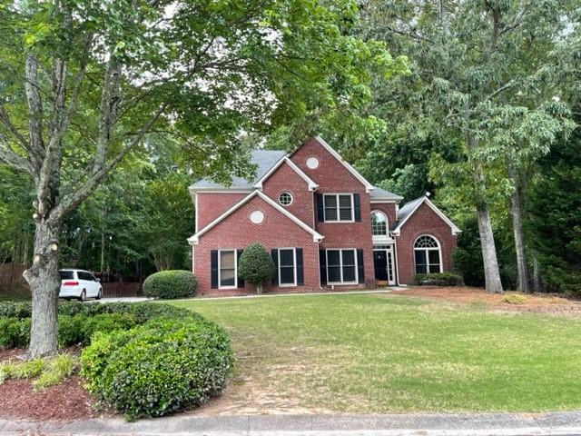 Excellent School districts from elementary to High school! Beautiful brick- front home with a bedroom on the main floor and side entry garage. The house is located at Cul-de-sac with extensive landscaping front and back. Coffered Ceiling, Hand-Scraped Hardwoods on the entire 2nd floor. Oak Hardwood Stairs. Big and huge kitchen with a huge breakfast island. Gorgeous custom stained Fireplace mantle. Upgraded high grade carpet and padding. Jack and Jill bath on the second floor. Fenced backyard with beautiful landscaping and a lot of woods. Charming covered back porch with stone walkway. This house 10 out of 10!!!