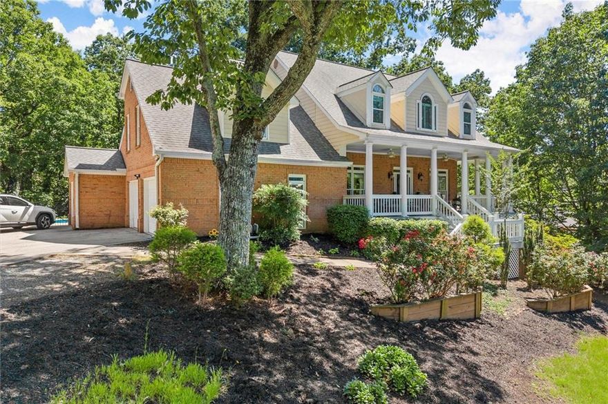 Welcome Home to 2936 Summitop Road - a private oasis your whole family can grow into!  Tucked away on a quiet, wooded lot, this spacious 5-Bedroom, 4.5-Bath home has everything you need — inside and out. From lazy Pool days to cozy movie nights, this home is built for making memories. As you walk up to the huge wrap around front porch take a moment to sit down and enjoy the view. Step inside to discover a spacious, thoughtfully designed interior where natural light pours through oversized windows, highlighting elegant finishes and timeless charm. The main level features hardwoods and new windows, large open living room and sitting room with gas fireplace and built-ins. A formal dining room (that doubles as an office now) will be perfect for holiday dinners or game nights. This kitchen is stylish AND functional with tons of cabinet space, a walk-in pantry, quartz countertops, SS appliances, gas cooking, breakfast bar, farmhouse sink and a large picture window overlooking the pool. Built-in bar with glass display cabinets, prep sink and ice maker compliments the kitchen and is perfect for entertaining. Whether you're having breakfast, dinner, doing homework or checking emails, you'll love the dining area with beautiful views of the lush landscaping, pool and deck! Upstairs, the primary suite is your personal retreat with a wall of windows overlooking the treetops, trey ceiling with beautiful crown moldings, a sitting area and a huge walk-in closet. The ensuite bath features a separate shower, double vanities and soaking tub. Three additional spacious bedrooms give everyone their own space. Two bedrooms share a Jack n Jill bath while the 3rd bedroom has an ensuite bath. Need extra space to spread out? The finished basement expands your living options! With space for a media or gaming room, storage for all your crafts and games, and fun Double Bunk Beds for sleep overs or cozy naps! Large open den is ideal for more entertaining with a 2nd gas fireplace and outdoor access. A separate bedroom is currently serving as a large closet and a separate full bath can become an in-law or a teen suite. If you love outdoor living, this yard is the ultimate backyard hangout. The secluded backyard gives you all the peace and quiet you crave with a 2 level deck - one for dining and grilling, the other for chilling! Get ready for summer fun at your own private pool with space for sunning and relaxing. Whether you’re hosting a BBQ, swimming with the kids, or relaxing on the deck with a cup of coffee, this yard is a total vibe. Located in the Top Rated Lassiter High School district with easy access to parks, shops, and restaurants, this home checks all the boxes. Don’t miss your chance to live your best family life in a home that truly has it all!