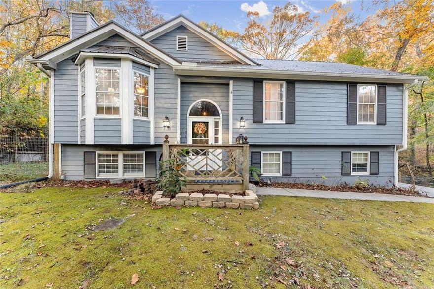 Sellers motivated, bring all offers!  NO HOA, privacy privacy privacy!  This huge 1.56-acre lot with a creek, fenced back yard and surrounded by hardwoods.  Split foyer, 3/2 with mostly bamboo/ceramic tile and hardwood flooring, leaving only one small room with carpet. Newer HVAC, hot water heater and metal roof! 
There is a partially finished lower level with a full bath (newer construction), a 2-car garage with a workbench, auto garage openers. Outdoor kitchen with hot/cold water in sink, flat top and gas grill all included. Tax records do not reflect finished area on lower level. Full house water filtration system.