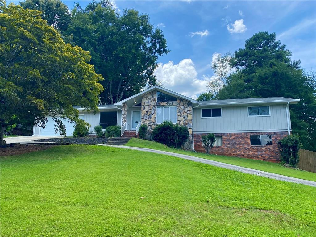 This home has a spacious layout to fit a family, One level living with a finished basement- Perfect set up for a rec room/ teen space/ craft room/office, etc. Brand new carpet throughout main level LR/FR/DR/Sunroom. Large Deck overlooks a spacious fenced in yard. Lawn Care is Included. Excellent Marietta Location in Top School District. This Home will Not Last Long! NO PETS.