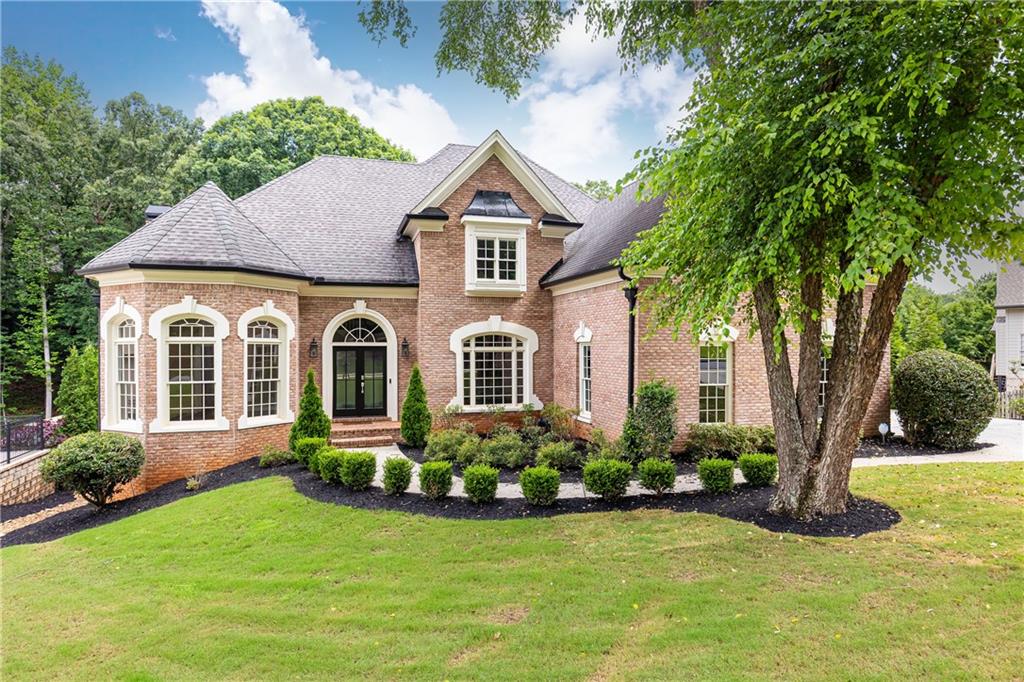 Sought after 6 Bed/4 Full Baths and 2 Half Baths home for rent in Nesbit Lakes for $6,500/month. This renovated 3 story Single-Family Home features 6790 Sq Ft, with a 3 car garage, an open floor plan and master on the main. Large white kitchen with stone countertops, glass backsplash and new appliances. Kitchen opens to family room with 2 story stacked stone fireplace and vaulted ceilings. Master on main with huge walk-in shower, 2 separate vanities and 2 walk-in closets. Upper level features 4 large bedrooms with 2 jack and jill bathrooms. Fully finished terrace level with additional bedroom, full bathroom, gym, office, small kitchen/bar, and more. Ample storage. Fenced in backyard perfect for entertaining and playing. No pets. Rent includes yard maintenance, so no need to mow the lawn. Beautiful Alpharetta neighborhood with 2 large lakes, active Swim/tennis, ALTA and USTA, pickleball, playground, and clubhouse. All occupants over the age of 18 must submit a separate application, qualify, and appear on the lease agreement. Owner requires: a minimum 12 month lease, credit score of 700 or better, NO evictions, security deposit ($6,500) + 1st and last month's rent ($13,000) are due upon signed agreement. Tenant must have renters insurance and a liability insurance coverage minimum of $500k. Tenant pays all utilities. Two year lease for $6,400/month for the first year and $6,500/month for the second year.