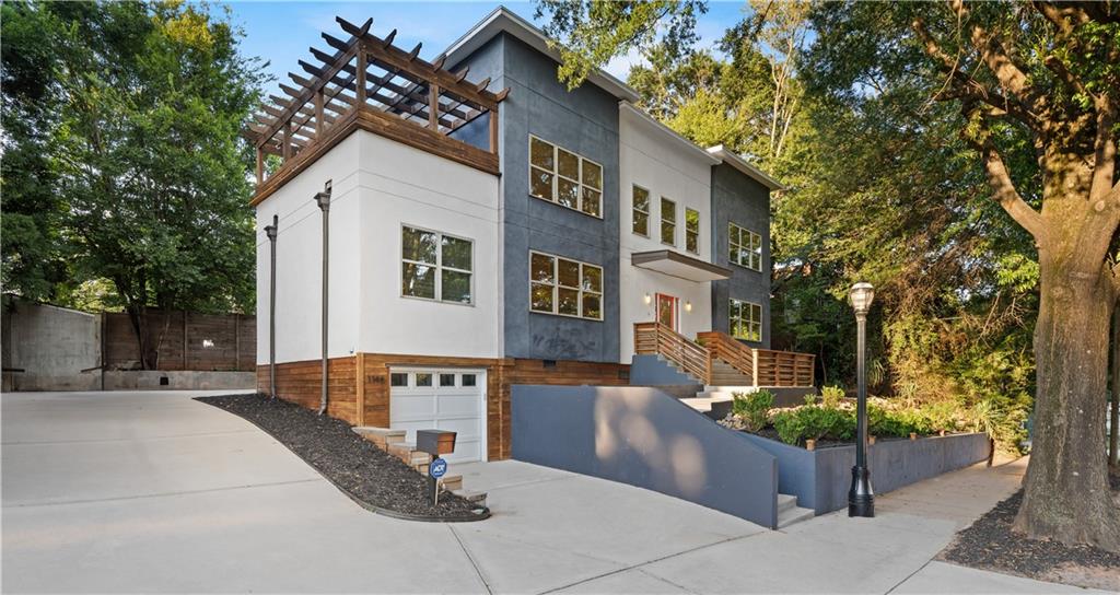 Welcome to 1146 Ponce de Leon Avenue—set along one of Atlanta’s most iconic streets and surrounded by the city’s premier lifestyle destinations. Just moments from Ponce City Market, the BeltLine, Inman Park, Virginia-Highland, Poncey-Highland, and Little Five Points, this modern four-bedroom, three-bathroom residence places you at the center of Atlanta’s dining, culture, and entertainment scene. Inside, expansive living and dining areas create the ultimate entertainer’s layout, complemented by a spacious centerpiece kitchen designed for gathering. The home’s flexible floor plan includes a versatile loft upstairs that can serve as a game room, media lounge, or additional sleeping quarters. Off the loft, step outside to a private rooftop terrace with a pergola—an inviting outdoor extension perfect for dining, lounging, or entertaining. Outdoors, a private backyard invites customization, with room to create your own Zen retreat—imagine a garden sanctuary complete with a seating area, hot tub and water feature for the ultimate in relaxation and entertaining. The property also features a one-car garage plus a parking pad accommodating four additional vehicles. Whether you’re seeking an in-town lifestyle, an entertainer’s haven, or a unique investment opportunity, 1146 Ponce de Leon delivers unmatched access and endless possibilities.