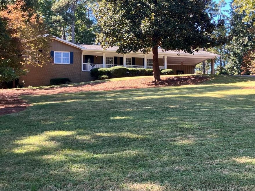 Welcome to this stunning fully updated brick ranch nestled in prestigious Whitlock Heights. Located minutes from the charming Marietta Square, this home seamlessly blends traditional charm with modern updates. Formal Living Room and separate Dining Room; bright and airy Kitchen with designer finishes including quartz counter tops, island, striking tile back splash and sleek stainless steel appliances. 3 Bedrooms and 2 Full bathrooms. Hardwood floors throughout. Fireplace in Den. New laundry area off the Den. All new interior and exterior paint and stylish new light fixtures throughout. Partial unfinished basement stubbed for bath. Situated on spacious 1.1 acre lot, the backyard is perfect for outdoor fun and relaxation. Large deck for entertaining. The Storage Room in the carport has a built in work bench and electricity. Close to shopping, dining, parks, schools and more. This home truly has it all! This lot also has access to Chestnut Hill Road. Perfect if purchaser want's to build garage or storage building.