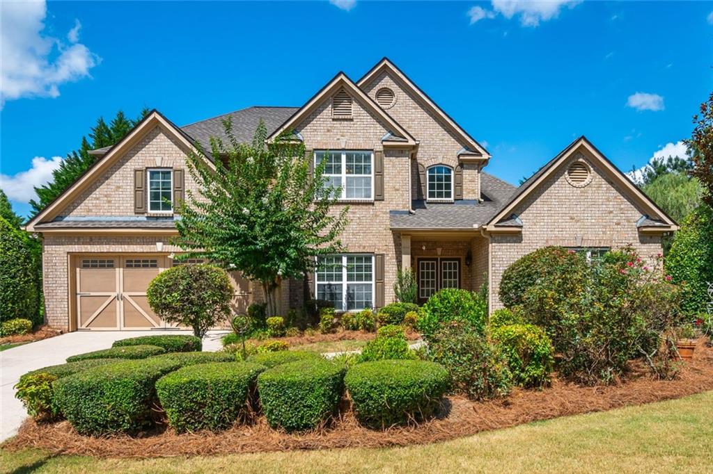 Formal Model home w Master On Main, Formal Living Rm / Office features custom Built-ins, Separate Dining Rm, 2-Story Family Rm w Built-ins & Double Sided Fireplace, Open Kitchen w Island, plenty of Counter Space / Cabinets, Breakfast Area, Large Walk in Pantry. Stunning Back yard w enhanced landscaping, No neighbor on the Right side of home, walk to Pool / Tennis / Community Firepit. 2nd Floor has 3 Br's w Walk in Closets, 2-Full Baths, Built-in Work station. You are close to GA-400, Lake Lanier, Northside Forsyth Hospital, HD, Lowes, Costco, a ton of restaurants, Target, Walmart, Multiple Parks (bike trails, Walking trails paths, Dog Parks, Covered Playgrounds all 15m or less away). Yes Easy access to everything you could possibly need. No HOA Rental Restrictions