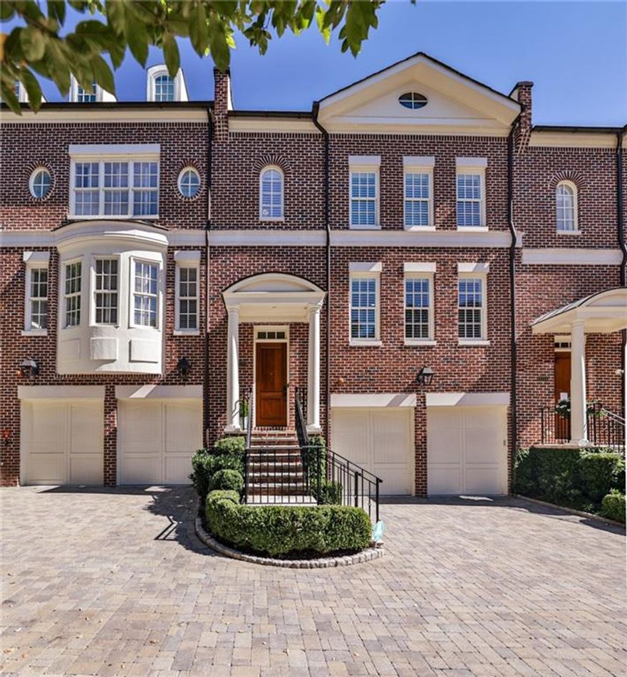 Unique opportunity, intimate community of just 15 homes in Vinings. Cobblestone paver driveways, gas lanterns exudes timeless, elegance and sophistication. Step inside to 10 foot soaring ceilings, freshly painted home, gourmet kitchen, plantation shutters throughout and gleaming Hardwood Floors on both the main and upper levels. Your family room has a gas fireplace framed by custom built bookcases. Unique to this townhome is a charming balcony overlooking a tranquil wooded backyard. Separate dining room for hosting family and friends along with a Butler’s pantry and a bar for entertaining. up one for the oversize primary suite, double walk-in closets and spa like bath or just what you want to welcome you home. The top level you’ll find a large en suite with endless possibilities home office, art studio playroom, or exercise space. The terrace level is equally as impressive with slate floors, a cozy fireplace, full bath and direct access to a lovely patio. Elevator Installed! New Marvin Windows, State of the art security system in newer HVAC systems. Walkable to Vinings Village where you can enjoy great shops, eateries and just a short distance from Buckhead, Truist Park/battery and easy access to I-285/I 75. Also enjoy the benefit of low Cobb county taxes!