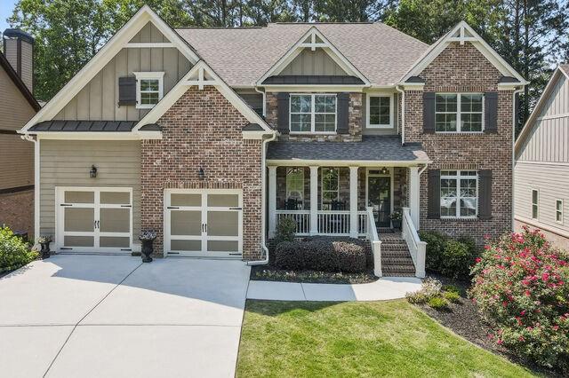 Well maintained, cul-de-sac home in the master-planned neighborhood of Seven Hills! This home greets you with a brick and stone front featuring a rocking chair front porch that overlooks not only the front yard, but also the greenspace across the street. You'll enter to find a two story foyer and gleaming dark hardwood floors. Large formal dining room to your left and a flexspace/office to your right. The family room features a soaring two story stone fireplace and is open to the white kitchen with ss appliances and granite countertops. The first floor also features a guest suite with full bath and large closet. The second floor has four bedrooms all with en-suite bathrooms. The large primary suite features tray ceilings, a large closet, separate shower, garden bathtub and a double vanity. Two bedrooms share a jack and jill bath with individual sinks. The laundry room is also conveniently located upstairs. The home has a full daylight basement ready for you to customize that opens to a flat, private, irrigated yard. This home is in close proximity to the most amazing 13 acre amenity park with a pool that features a water slide, zero entry pool and 10 tennis courts. You'll also find restaurants and shopping less than a mile from this home!