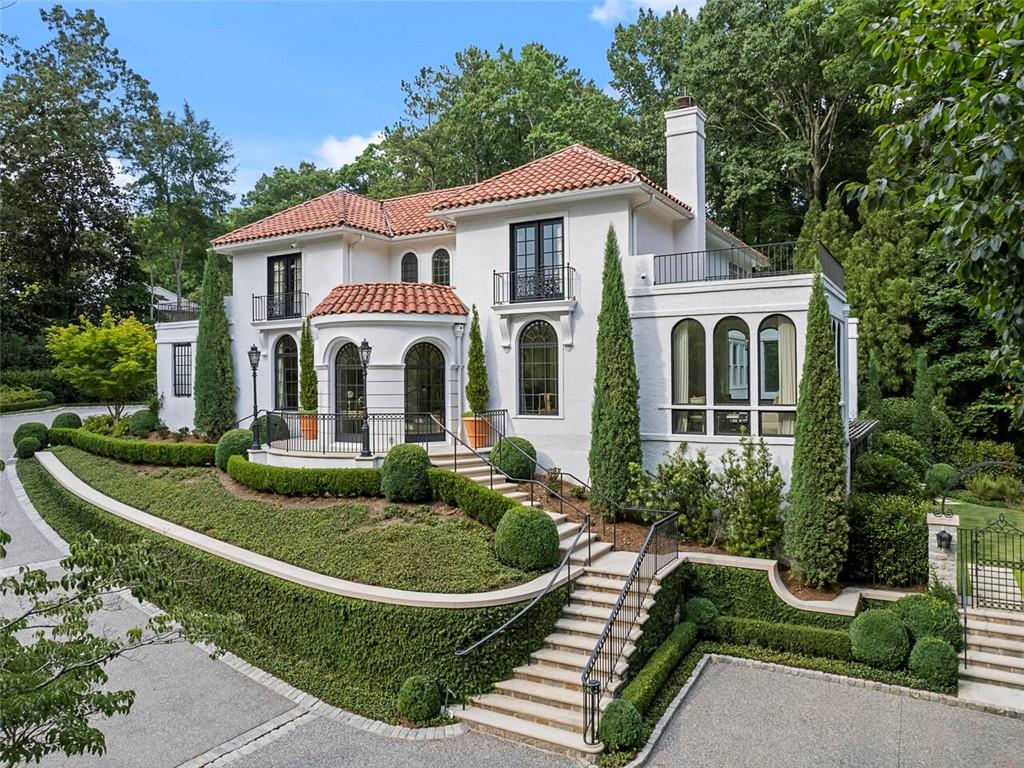 Situated on a quiet street in Tuxedo Park sits an incredible opportunity to move right into a home that has been nearly rebuilt by a team of craftsman and led by architect Norman Askins. The house was completely reimagined in 2019 and took almost a year to complete. The residence has the latest in Control 4 home automation, energy efficient spray foam insulation, all new iron windows and doors, motorized blinds, new pool, new aggregate driveway and added an additional two car garage and guest parking. The owners engaged Susan Boseman for the interiors and McGarity-Garcia for the renovations. Beautiful natural light throughout and plenty of space for entertaining indoors and out to the private walk out pool and covered pool house with fireplace. Open in design the rooms flow flawlessly from the living room to the kitchen, keeping room and breakfast room and all with doors out to the pool. The kitchen with quartzite island and motorized TV that retracts into the island has plenty of storage capacity and also features a walk in pantry. Subzero, dual dishwashers and custom cabinetry complete the kitchen. Flat side yard and garden with covered trellis that opens into the lower level of the terrace level. All new systems, water filtration and whole house generator. Redone stucco exterior and over half of the tile roof system. Downstairs is a media room, gym with full bath and another guest bedroom. For entertaining outdoors, enjoy the covered seating area on the other side of the pool with fireplace and there is an outdoor grilling station next to the kitchen. Guest bedroom on each level and owners suite is upstairs with additional sun filled sitting room and a beautiful wood paneled office. Furnishings negotiable.