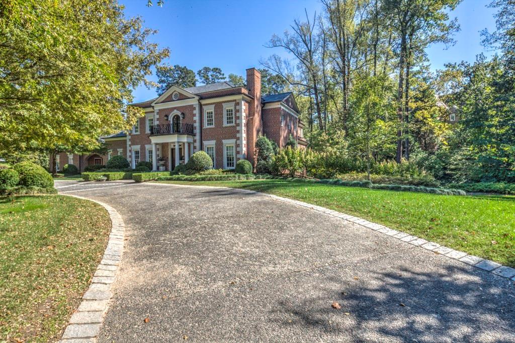 Rare opportunity in Tuxedo Park, Beautiful custom built gated estate by Harrison Design and award winning designer Suzanne Kasler. Lovely new light filled kitchen in 2014 opens to breakfast/family room area. Master suite (new bath 2014)on main opens to rear terrace/covered porch overlooking private back yard/ pool. 4 secondary bedrooms and baths up with large playroom/gathering area. Terrace level features, theatre, gym, second laundry room, guest suite/private bath, rec room, bar and pool bath. Sport court conveniently located for viewing from kitchen/family room area