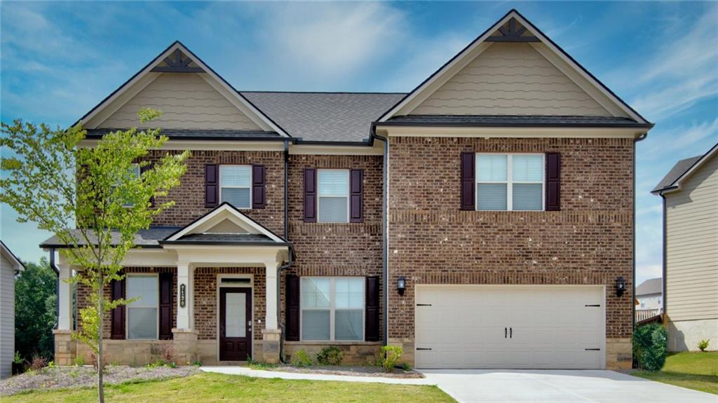 This nearly new home was built with gorgeous design upgrade and elegant trim package thought out. The home features an open loft area up, and a guest suite on the Main. Hardwood floor covers the entire Main level. Entry foyer opens to formal Dining & a Study room. Great Family room with Coffered ceiling and fireplace facing the breakfast area & kitchen, center island for bar stool seating around the granite countertop, a spacious walk in pantry sits on the side. Up loft gives you open space for entertainment or office. Primary suite comes with enlarged shower and spacious walk-in closet, hall bath for two secondary bedrooms and walk-in closet for each. The home is also equipped with SMART HOME PACKAGE, including Ring Doorbell, Echo Show 8", Ecobee Thermostat and Kwikset Halo Smart Front Door Lock. Enjoy the covered patios front and back, with private view to the greentrees behind the backyard! This subdivision is close to Lake Lanier Marina and Lanier Water Park for boating and fun!