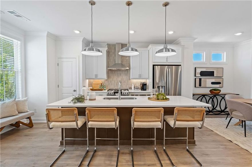 Summer of Savings! $20,000 anyway promotion for contracts in June 2025.  Palisades is where the charm of mountain living meets modern sophistication! This exquisite Garwood floor plan by The Providence Group is a remarkable townhome nestled on the mountainside, offering stunning vistas of Cumming. With Energy Star Certification, the home beautifully marries rustic appeal with contemporary comforts. Upon entering, you'll find a welcoming recessed foyer leading into a bright, open-concept living space. The airy great room effortlessly transitions to a sunroom, a peaceful retreat perfect for savoring the sweeping views. Designed for seamless living, the Garwood floor plan boasts gas appliances and a range of thoughtfully selected energy-efficient features. The interior finishes are part of our stunning warm stone design collection, created by our award-winning design team. Located just a short drive from Cumming City Center and downtown, you'll enjoy convenient access to a variety of shops and dining options. Whether you're discovering the vibrant local culture or relaxing in your serene mountain getaway, this townhome offers the ideal blend of luxury, comfort, and convenience. Don’t miss this exclusive opportunity—your new home at Palisades awaits! [The Garwood]