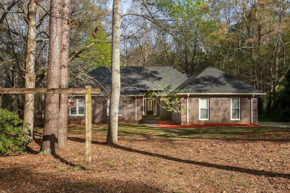 This home showcases a comprehensive renovation completed in 2020, featuring a 250 sq ft upstairs addition, a fairly new roof, and extensive kitchen and bathroom updates. The main level accommodates four spacious bedrooms, and an upstairs flex room offers flexibility for various uses, such as a home office, theater, or guest retreat. The inviting split-foyer layout, expansive living areas, and abundance of natural light create a warm atmosphere, particularly with the large deck overlooking a private lot lined with mature trees. Situated in a peaceful Carrollton neighborhood near Lake Carroll, the GreenBelt and downtown, this home seamlessly blends modern amenities with timeless charm. Located in the Windemere Subdivision, this charming ranch is close to local amenities, including a short walk to the Greenbelt, 3 miles from Carrollton Square, and 1 mile from the bypass and Hwy 61. Key features of this property include a spacious family room, hardwood floors, a large backyard, a 2-car garage, a master suite with a vaulted ceiling, a tub and shower, a breakfast nook off the kitchen, an island, double ovens, a large laundry room, and a pantry. Home needs a little TLC and priced as such. The property is sold as-is. Seller is Motivated.