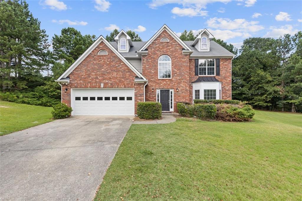 Welcome to this spacious 4-bedroom, 2.5-bathroom home spanning 2,617 square feet, perfectly positioned in a cul-de-sac within the desirable Fairmont on the Park subdivision in Dacula, GA. This recently updated home boasts new laminate flooring, plush carpet, and fresh paint throughout. Main Level Features: Open floor plan ideal for entertaining guests. Elegant kitchen with tile flooring, adjacent to a cozy breakfast nook. Inviting family room featuring a fireplace. Convenient half bath and separate living and dining areas. Upper Level Features: Luxurious primary suite with vaulted ceilings, a large walk-in closet, separate shower and tub, and dual sinks. Three additional well-sized bedrooms. Additional full bathroom and a walk-in laundry room for convenience. Community and Location: Fairmont on the Park offers fantastic amenities, including a pool, tennis court, playground, clubhouse, and fitness center. The neighborhood is conveniently located near schools, a variety of restaurants, grocery stores, the Mall of Georgia, and Highway 316. Special Incentive: Potential for up to $10,000 in closing cost assistance available when utilizing a preferred lender. For more information or to arrange a viewing, please contact the listing agent today. This home won't last long—make it yours!