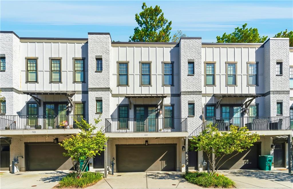 Discover modern luxury in this spacious 2-bedroom, 2.5-bath townhome in the highly sought-after Brownstones at Cosmopolitan. Featuring a two-car garage, soaring 10' ceilings and hardwood floors throughout the main level, this home offers an open-concept layout perfect for entertaining. The modern kitchen, complete with abundant storage, overlooks the living room with a cozy fireplace and stylish floating shelves. Retreat to the spacious primary suite with a contemporary bathroom featuring dual sinks, tile flooring, and a walk-in shower. Enjoy outdoor living on the large deck or utilize the additional bonus room downstairs off of the garage as a home office, gym, or creative space. Ideally located near Buckhead, Midtown, GA-400, I-85, shopping, and dining, residents can also take full advantage of the community amenities: a resort-style pool, expansive gym, movie theater, billiards room, and 24-hour concierge—all just two blocks from MARTA.