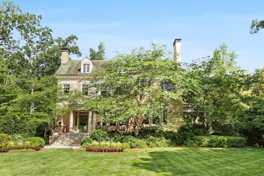 Designed by noted architect Neel Reid in 1918, Rest Haven was built for William Candler, youngest son of Coca-Cola founder Asa Candler. Set on two sprawling acres and completely surrounded by mature landscape, this home offers valuable privacy and a remarkable opportunity for the discerning buyer. Thoughtfully renovated to incorporate today’s modern amenities while carefully preserving the history and historic character, this home boasts 12’ ceilings on the main, generous formal living and dining spaces for entertaining a separate and private side porch off the dining room, a large, open kitchen family room with abundant natural light a fireside den and an additional, fireside office off the family room. Up the grand staircase to an additional, sitting area, a generous owner's suite and three additional bedrooms and full baths. The three-car carriage house hosts a large entertaining and living space along with a private porch, bedroom and full bath. Beautifully situated in the neighborhood with easy access to Emory and the Druid Hills Golf Club, Rest Haven is a special piece of history that is not to be missed.