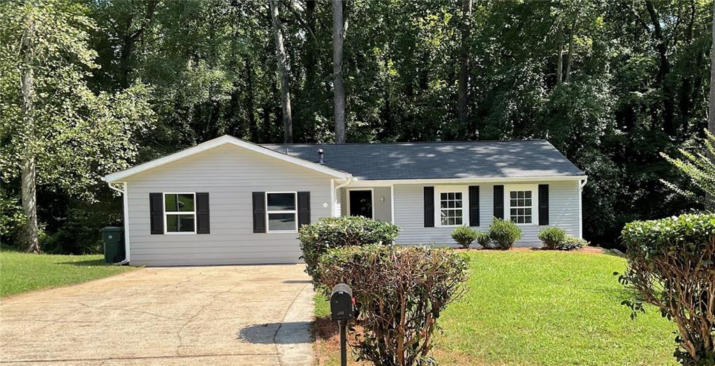 This charming 3-bed, 2-bath home on a quiet cul-de-sac is seriously special. Picture yourself relaxing on the huge deck surrounded by mature trees – it's like having your own private retreat! The stone fireplace creates the perfect cozy vibe, while granite counters and stainless appliances make the kitchen a dream.
Fresh paint and new flooring throughout give it that move-in-ready feel. The master suite is your perfect sanctuary, plus there's this amazing bonus room just waiting to become whatever you need – office, playroom, you name it!
The corner lot gives you both a tree-lined backyard oasis and a large grassy side yard with endless possibilities. This isn't just a house, it's where life happens – morning coffee on the deck, game nights by the fireplace, and everything in between.
Located in desirable Stone Mountain with great access to everything. This gem won't last long – come see why it feels like home the moment you walk in!